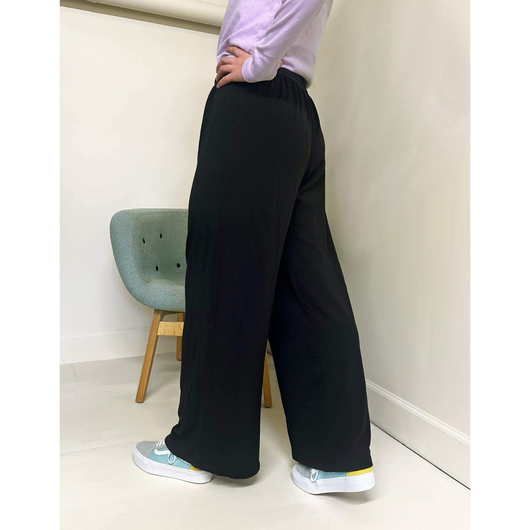 Female model wearing Women’s Overdyed Black Lounge Pants and a Women’s NC Ribbed Cotton Fitted Long Sleeve T-Shirt - Lavender.