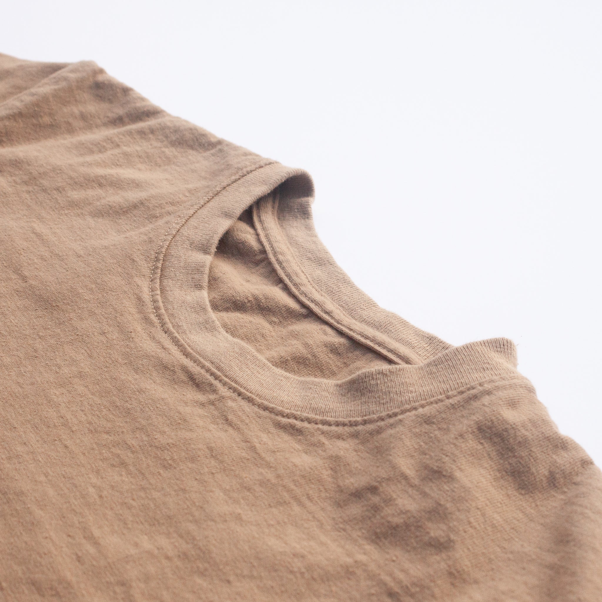 A close up photo of the collar of the American-made Solid State Clothing North Carolina Black Walnut Shirt