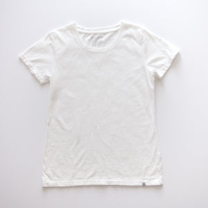 An American-made Solid State Clothing North Carolina Cotton T-Shirt lies against a plain background. The color of the shirt is white.