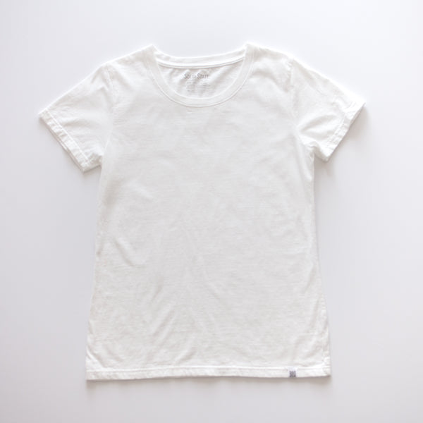An American-made Solid State Clothing North Carolina Cotton T-Shirt lies against a plain background. The color of the shirt is white.