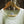 Load image into Gallery viewer, A white Solid State Clothing t-shirt is shown on a hanger. There is a tag with a QR code, which shows customers how the t-shirt is entirely made in the USA and tracks every step of the process behind how the shirt is made
